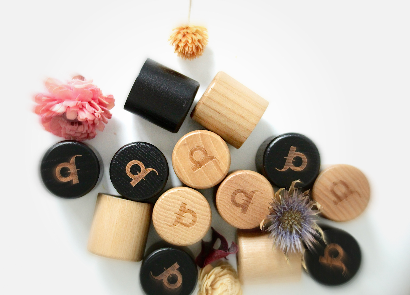 Elegant bottle caps of premium designer scents by Once Upon a Fragrance, set in a beautiful environment, showcasing long-lasting, affordable high-end French fragrances for men and women.